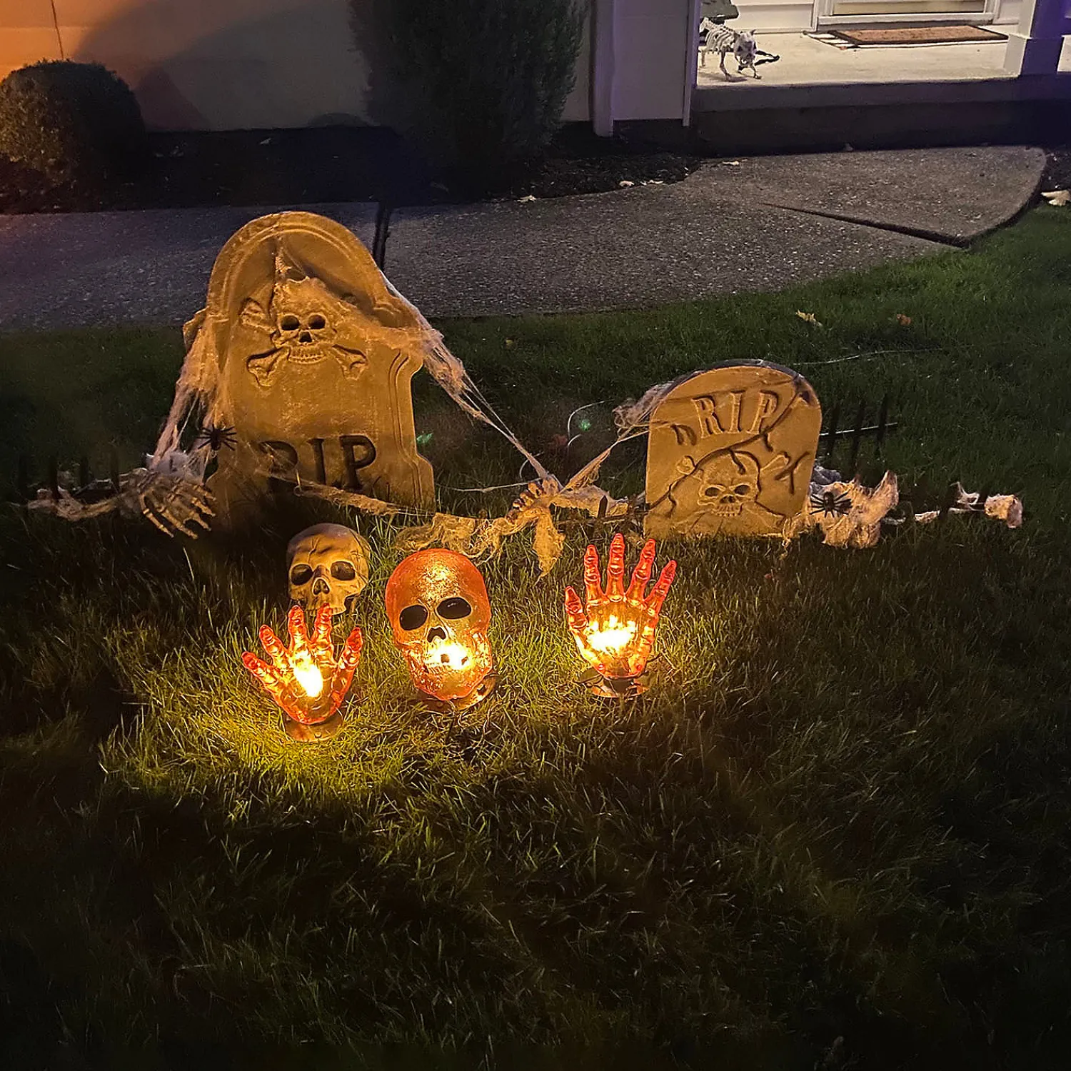 lighted_orange_skull_and_2.webp 8.5" Lighted Orange Skull And Hands Outdoor Halloween Decoration - 4Ft Black Wire<Oriental Trading Sale